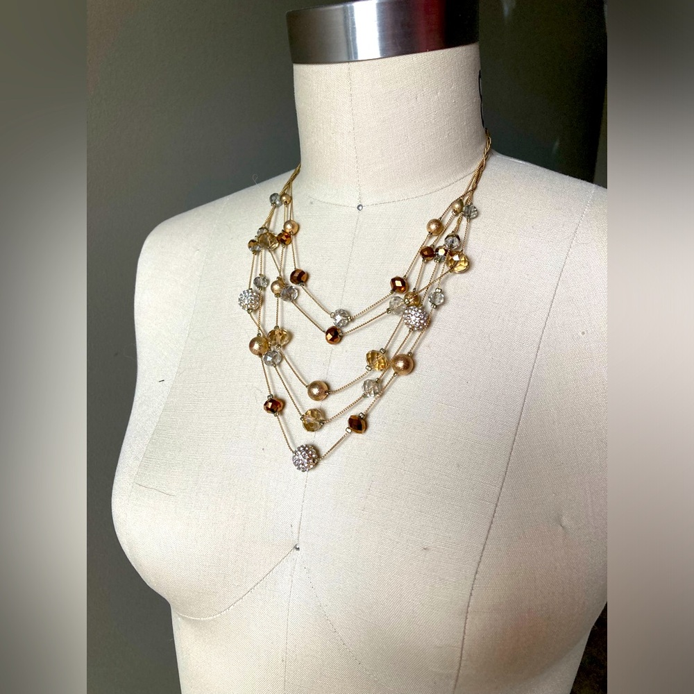Gold multi string necklace with sparkle beads